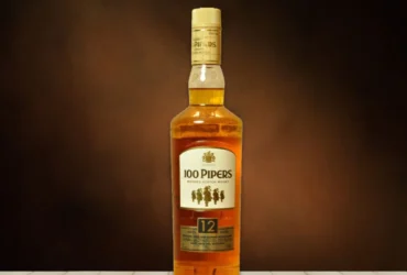 100 PIPERS 12 YRS DELUX SCOTCH